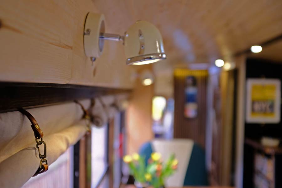 angled spotlights on a skoolie