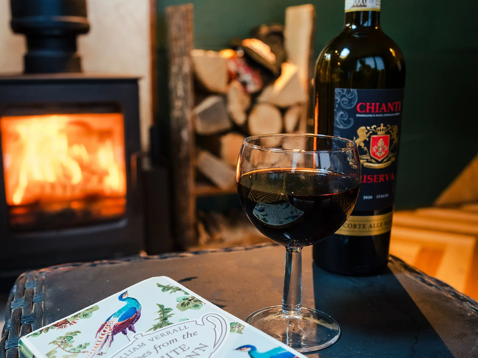 Cosy log-burning stove inside the Skoolie Stays bus